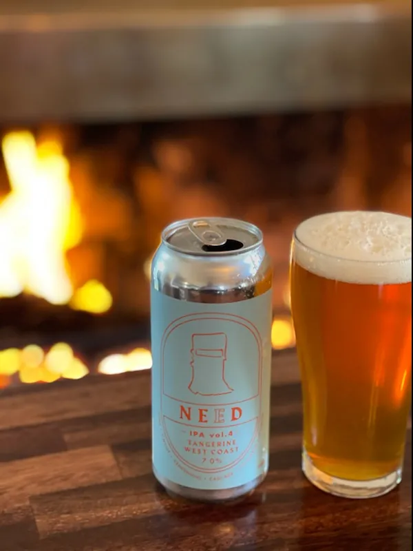 A pint by the fire pit at dusk