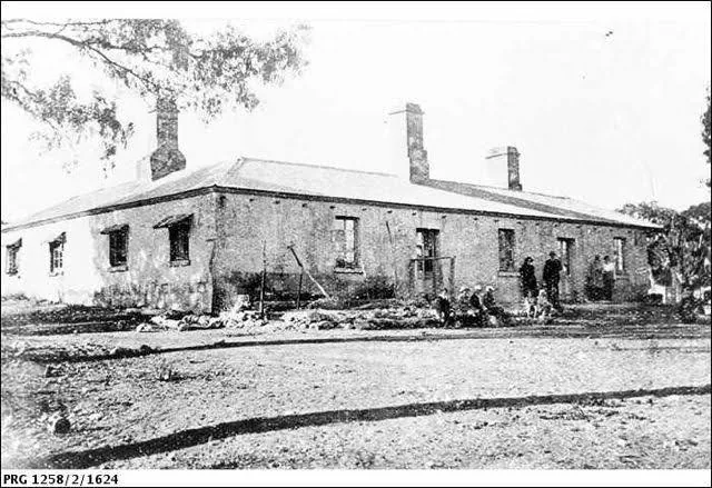 Early photograph of the hotel's long limestone frontage with its chimneys