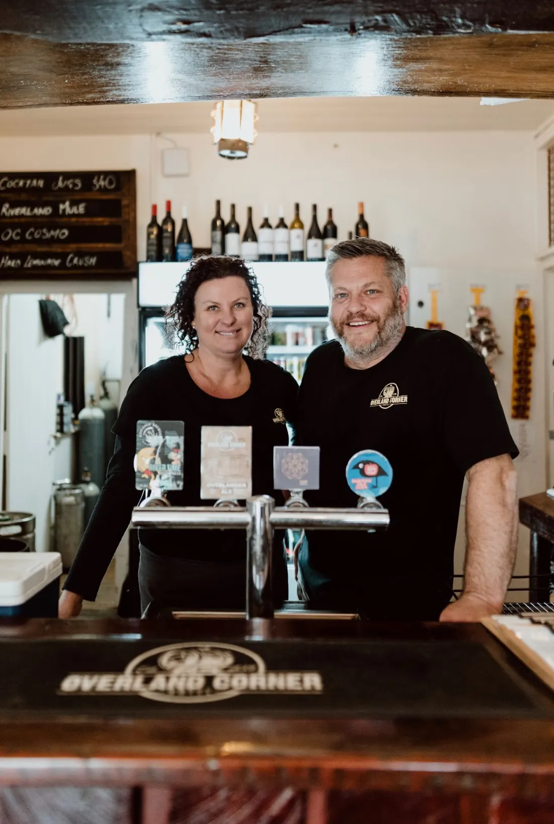 Hosts Brad and Nicole Flowers behind the bar